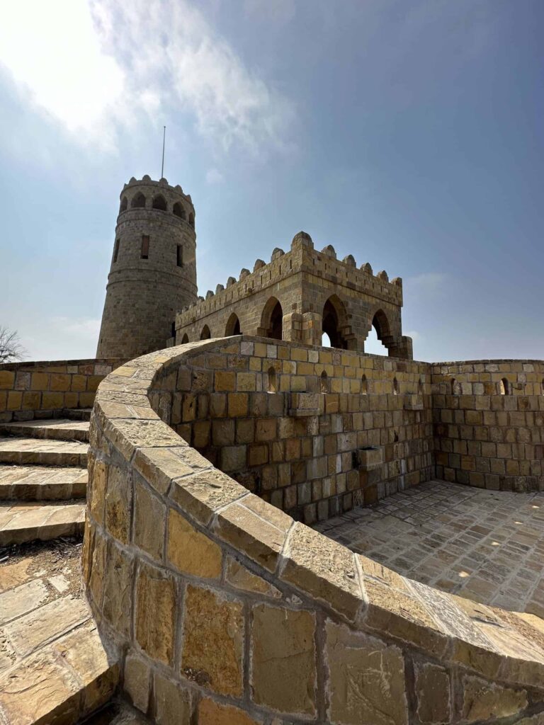 Sandstone steps lead up to a tall watch tower on Suwadi Island