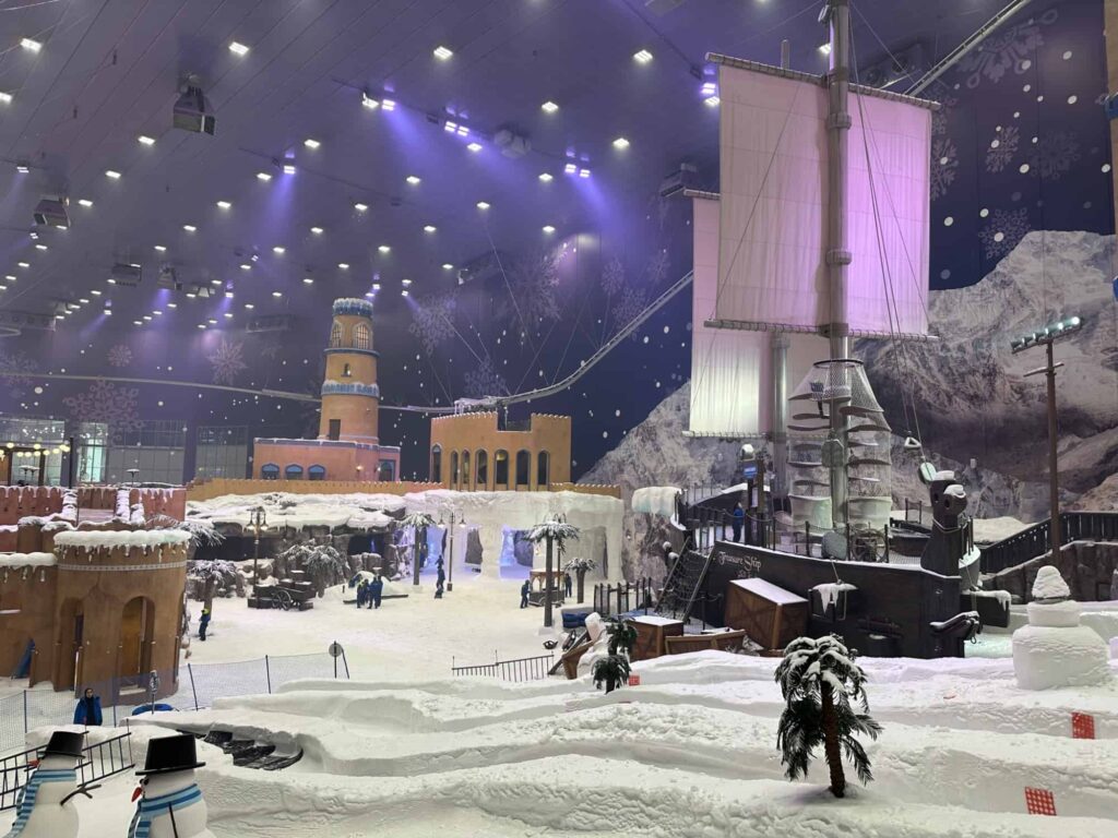 View of slides, the Treasure Ship and Omani-style buildings in the huge snow park