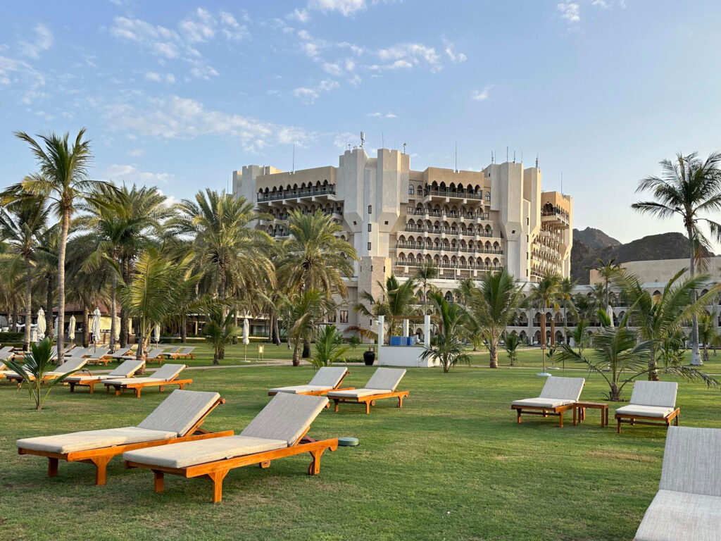 Sun beds on the lawn outside the Al Bustan Palace hotel in Muscat