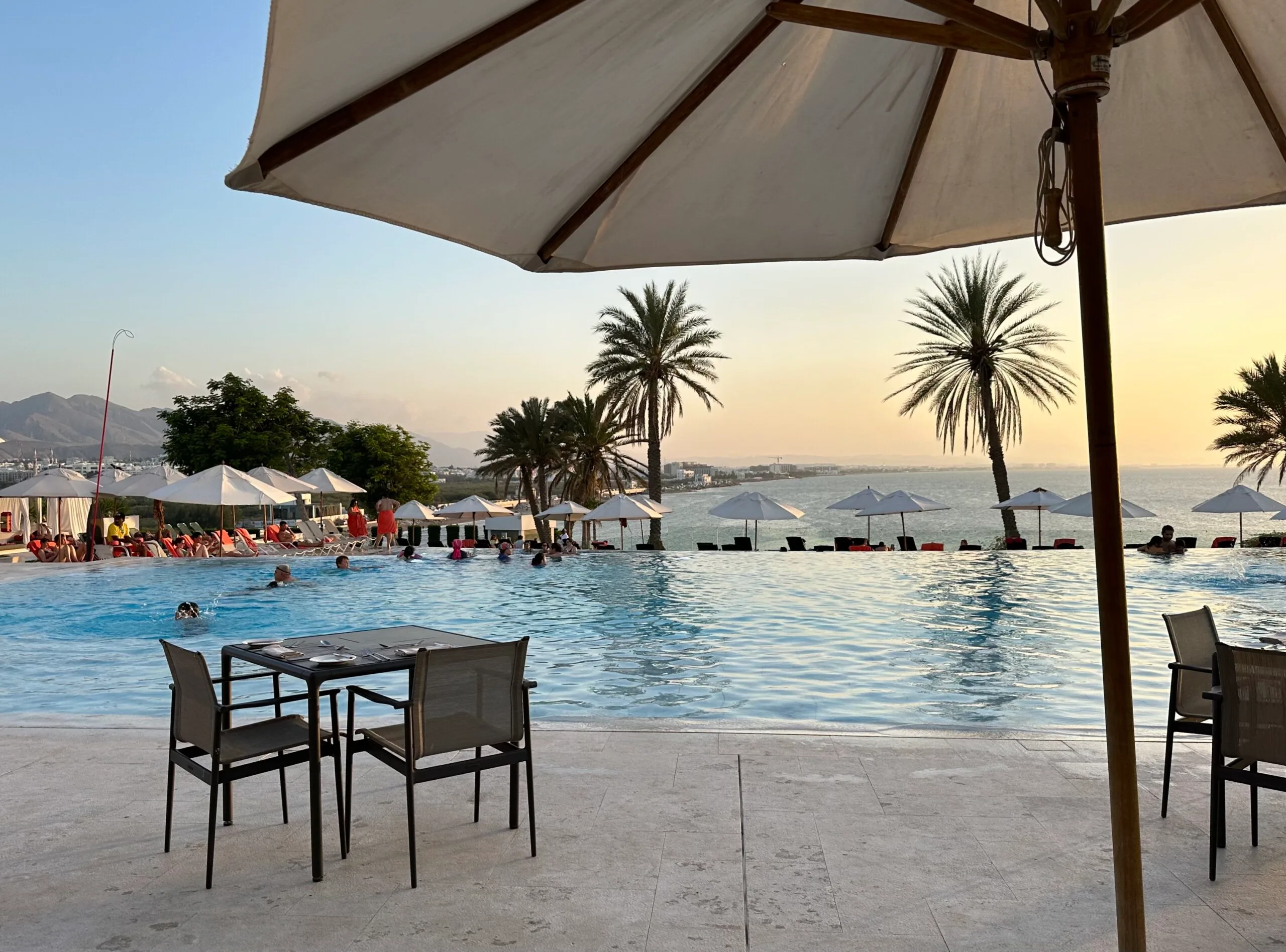 Sunset view across the pool at the Crown Plaza in Qurum in Muscat