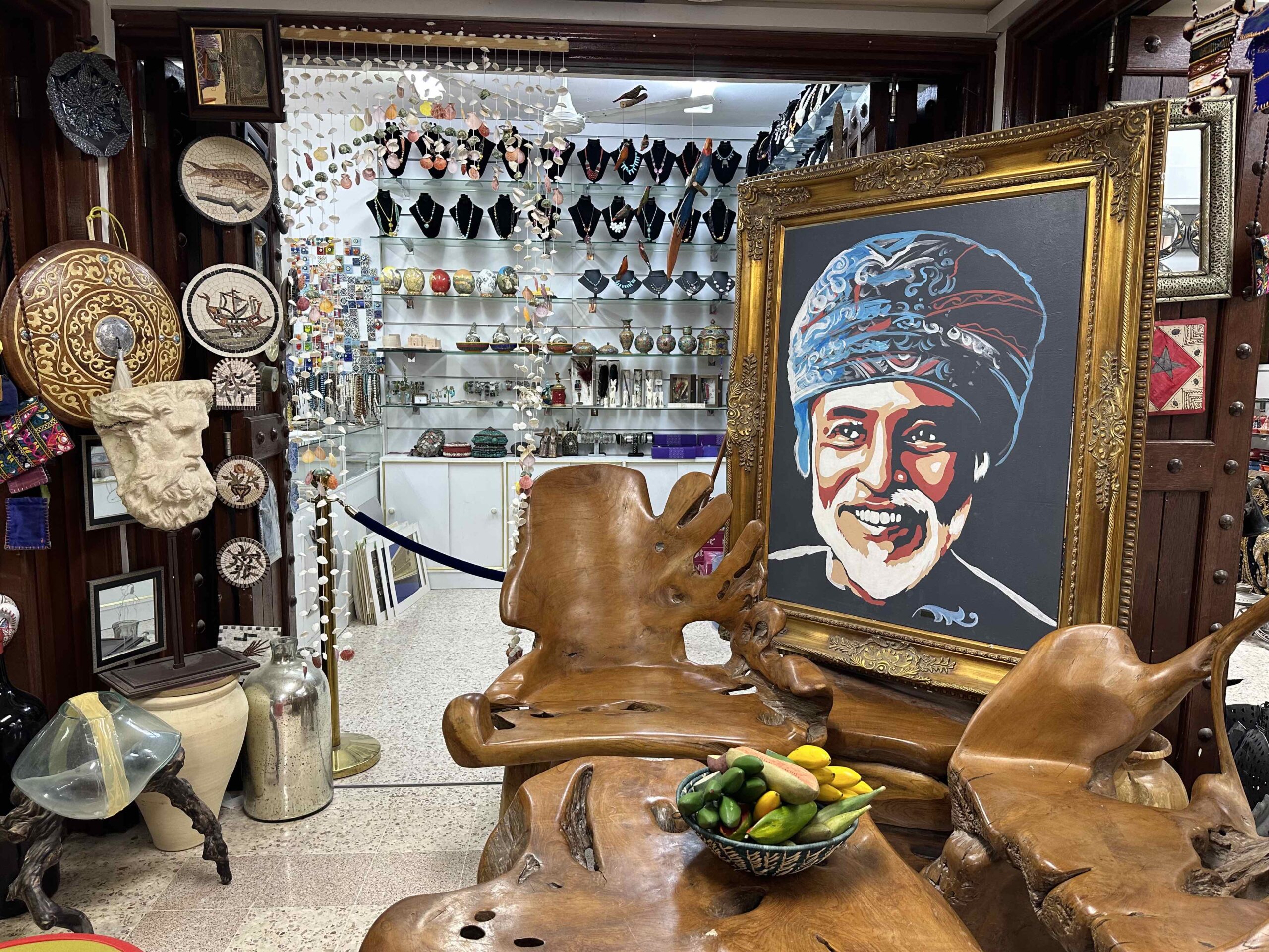 Portrait of Sultan Qaboos and antiques in the Souq at Nizwa