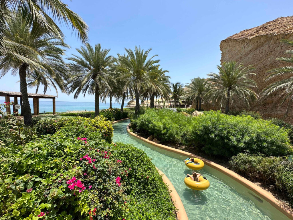 Our children in yellow rubber rings going around the lazy river at Shangrila Al Waha in Oman