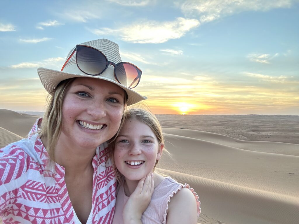 Me and my daughter at sunset in Wahiba Sands