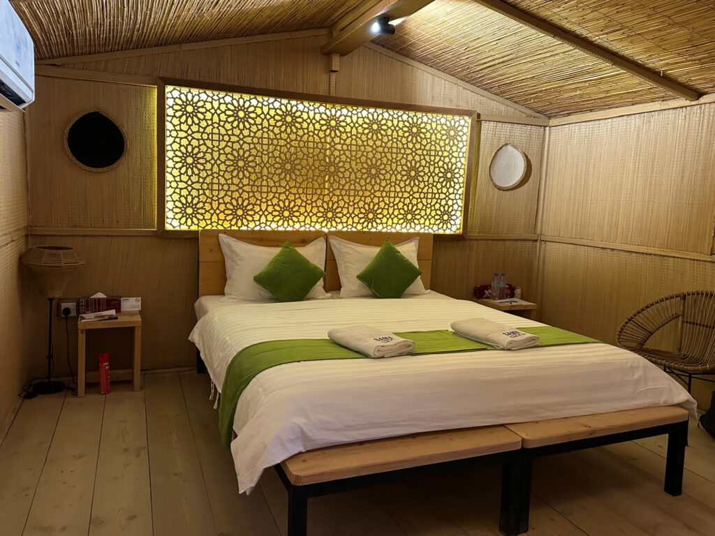 A double bed in a standard eco lodge at SAMA Ras Al Jinz Resort