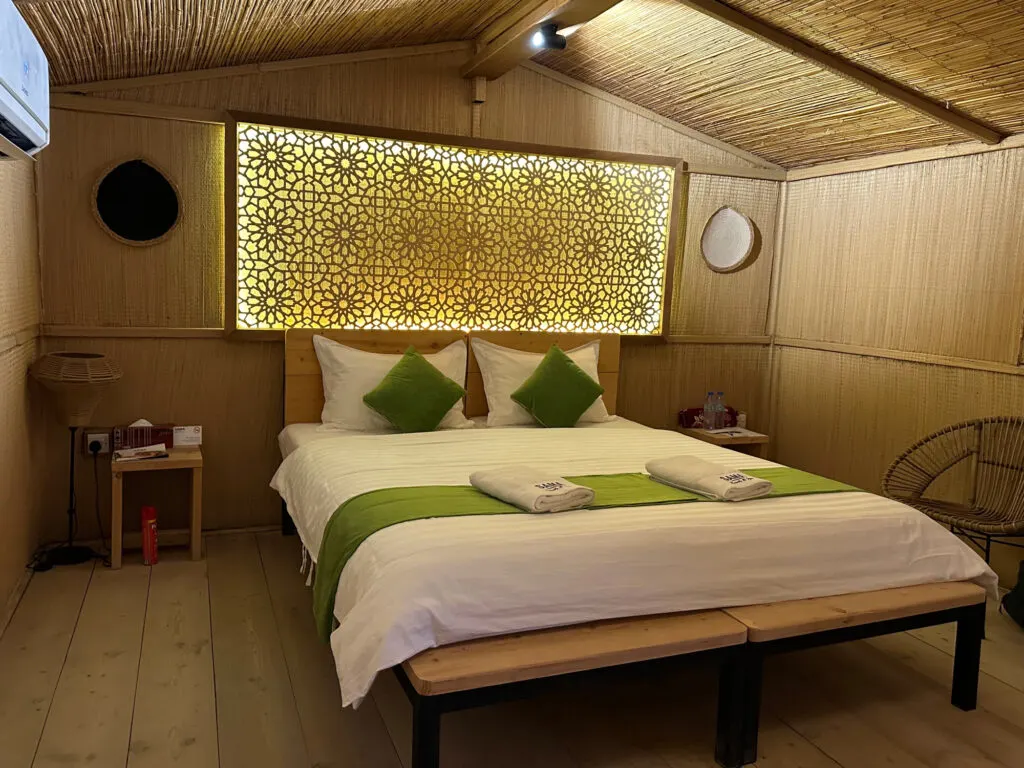 A double bed in a standard eco lodge at SAMA Ras Al Jinz Resort