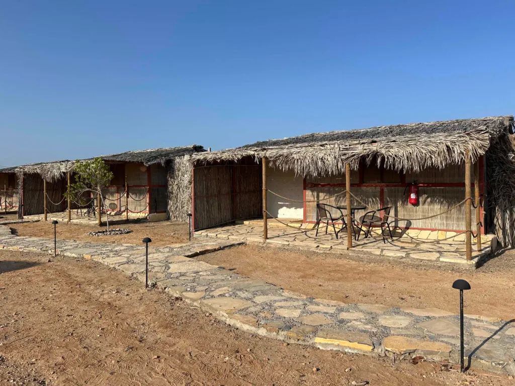 The outside of a row of standard eco lodges at SAMA Ras Al Jinz