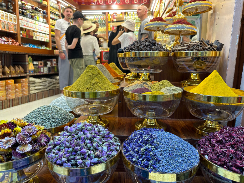 Spices, flowers and scents filed high outside a shop in Muttrah souq