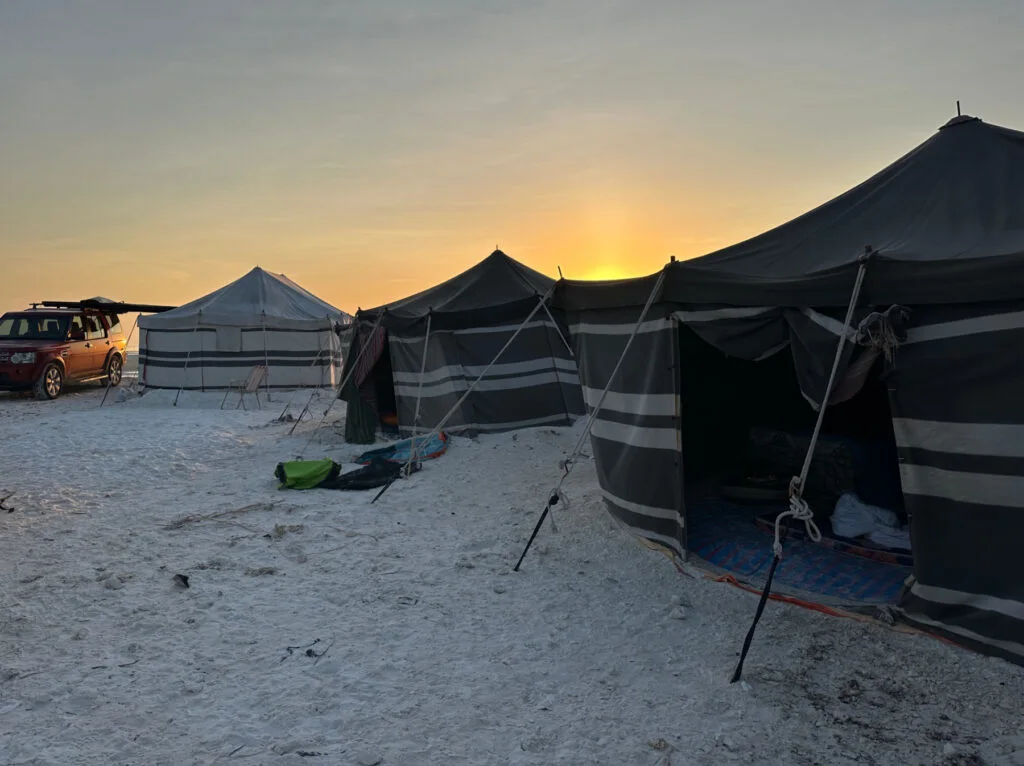Bedouin style tents pitched on the beach at Whales Head Camp at Barr Al Hikman