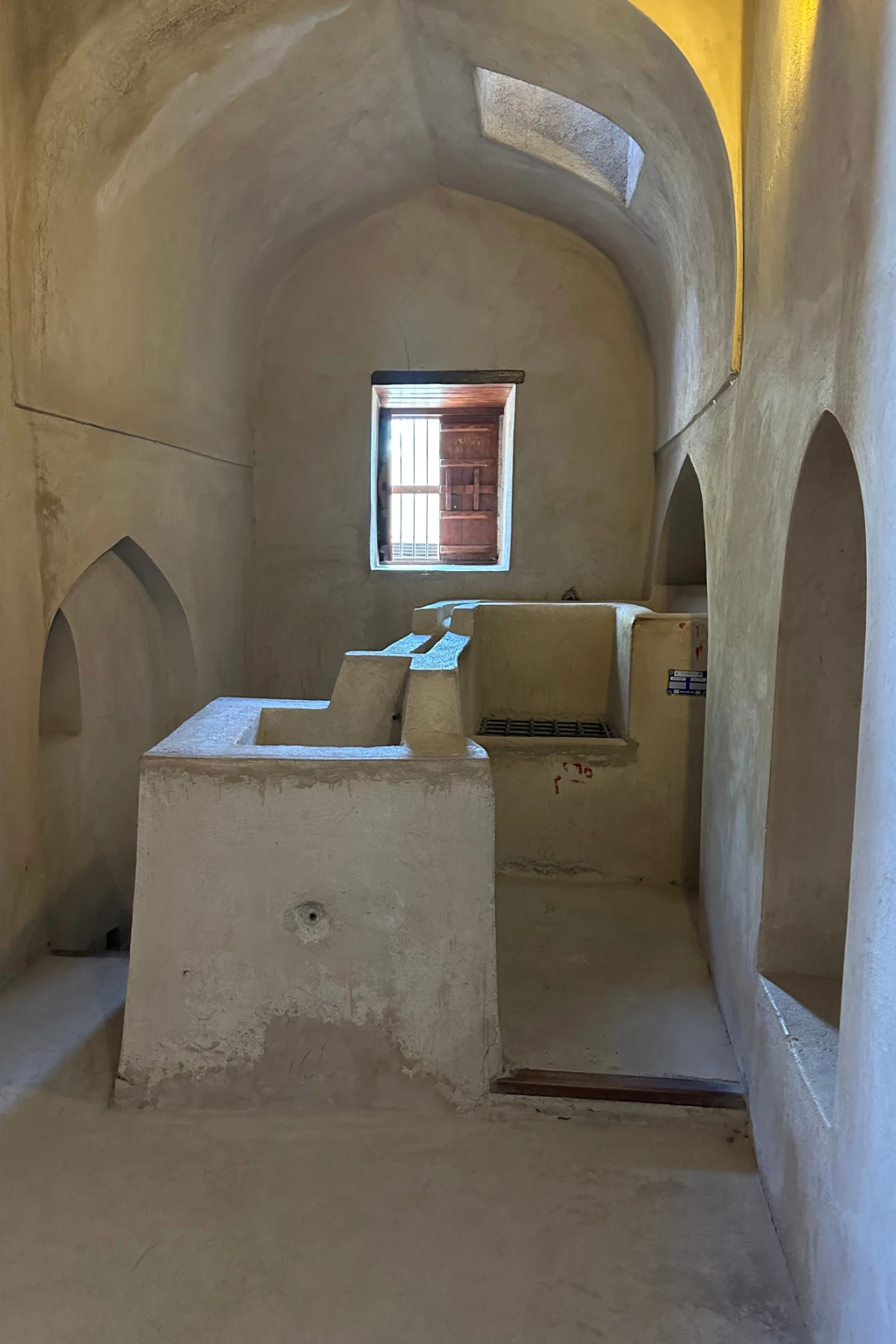 The Imam's bathroom. A domed room with a sink, concealed toilet and bath made from lime washed brick