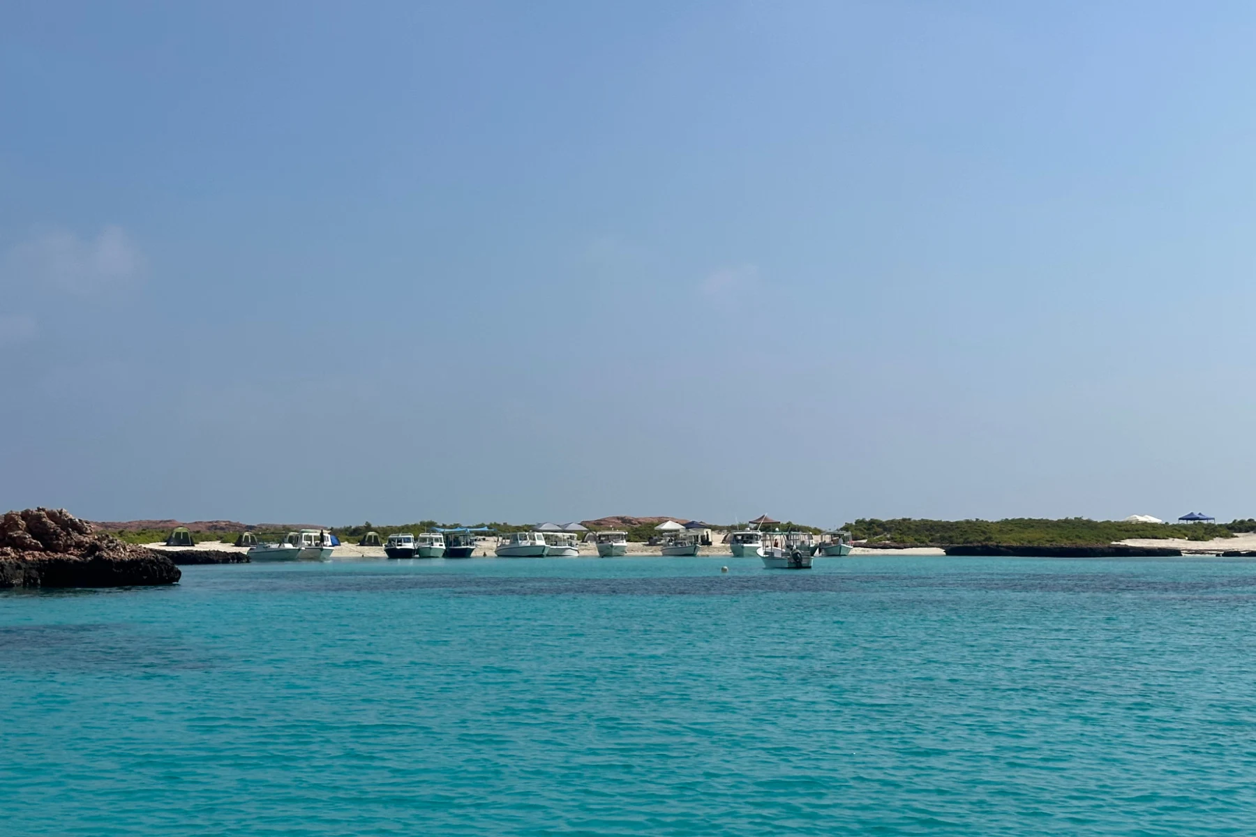 Tour boats near the shore of the Daymaniat Islands