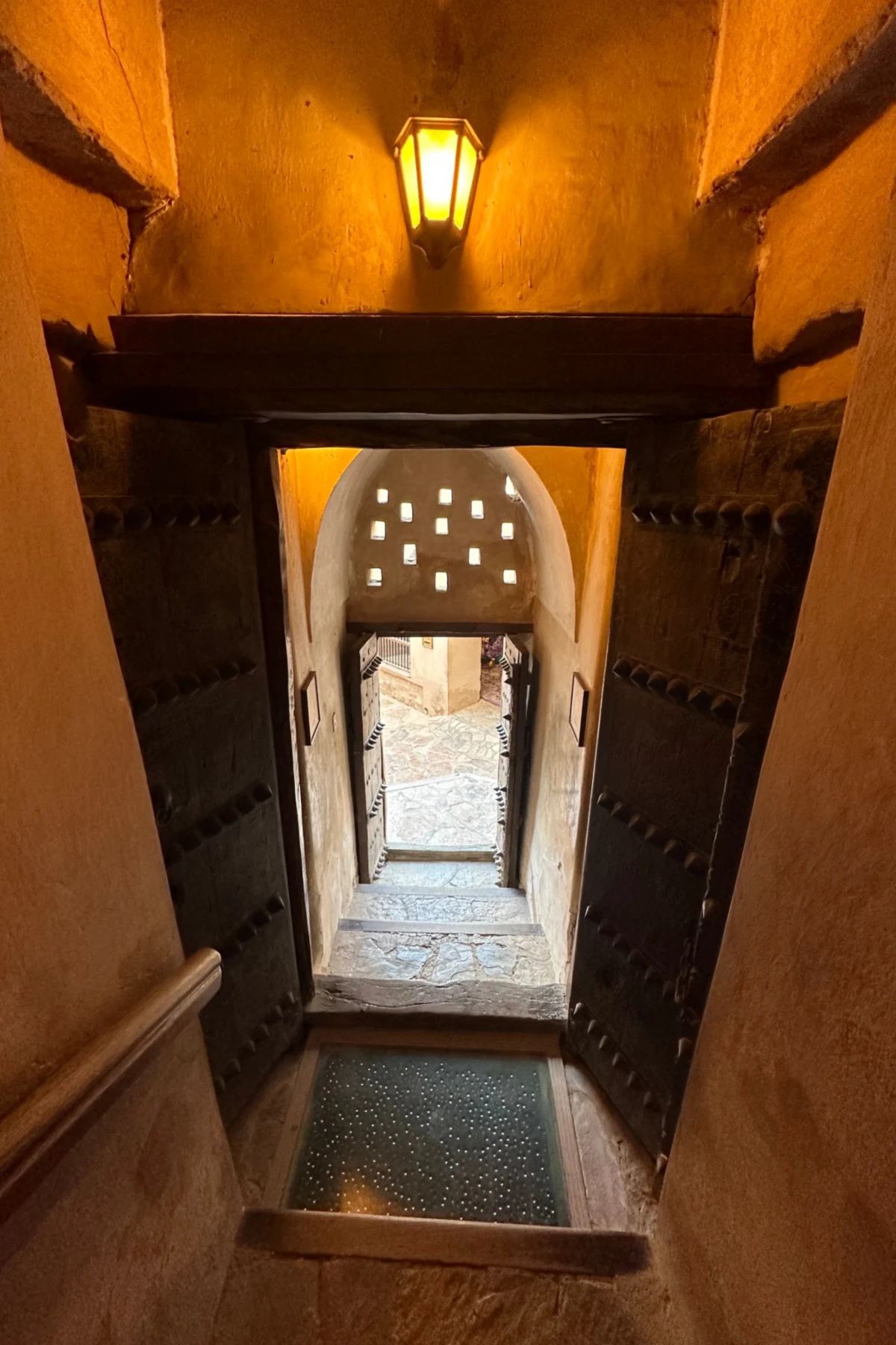 A doorway at the bottom of the fort where a man trap lays just inside the entrance