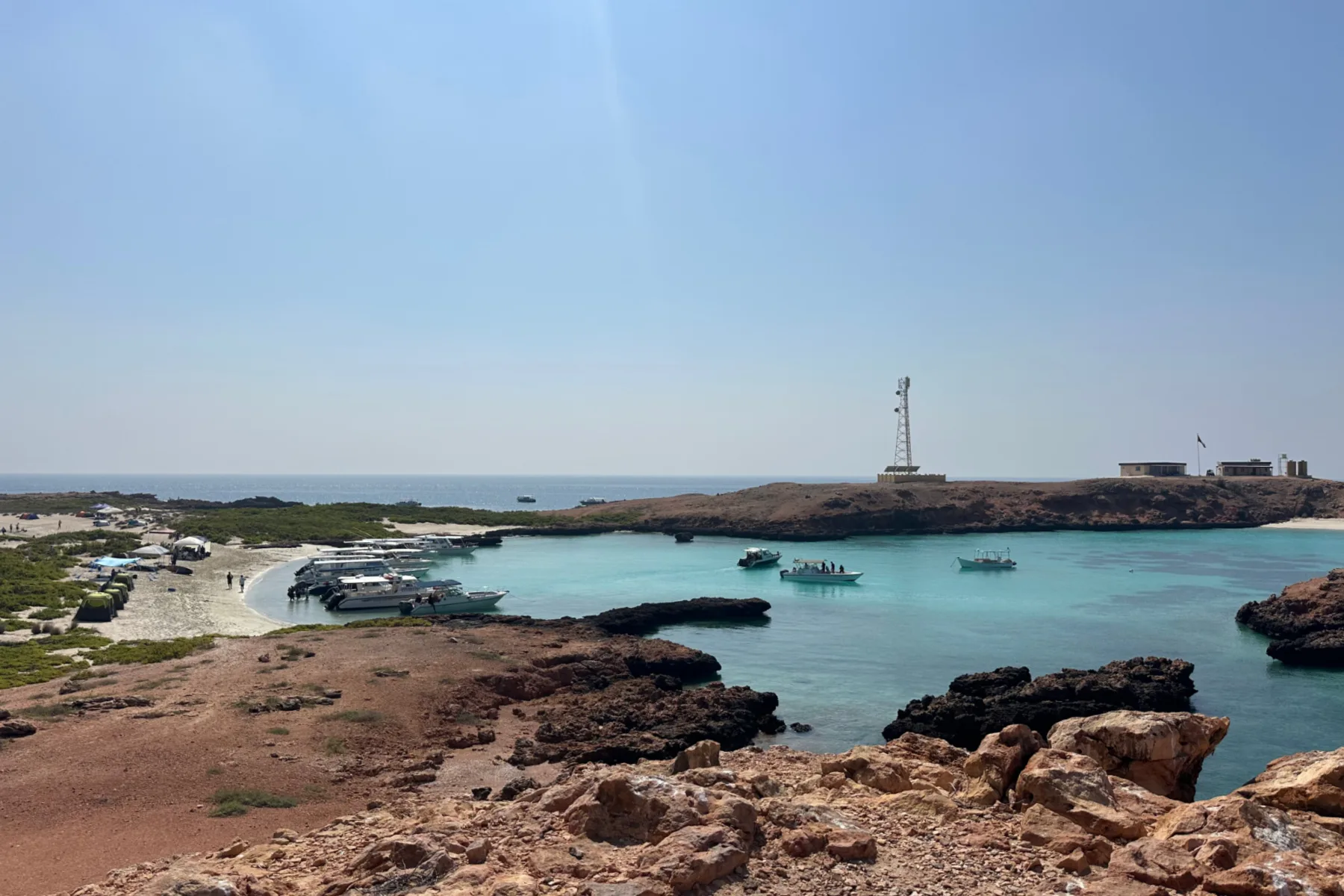 A view of a bay on Police Island. There is a research building and telephone mast