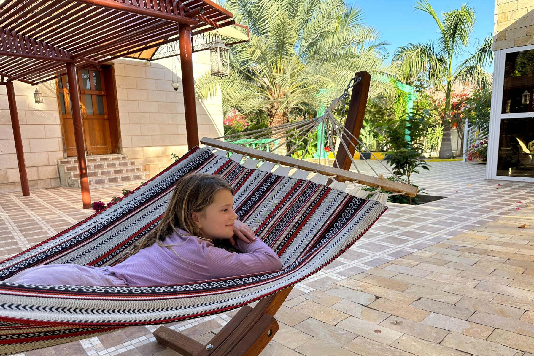 My daughter relaxing in a hammock in the gardens
