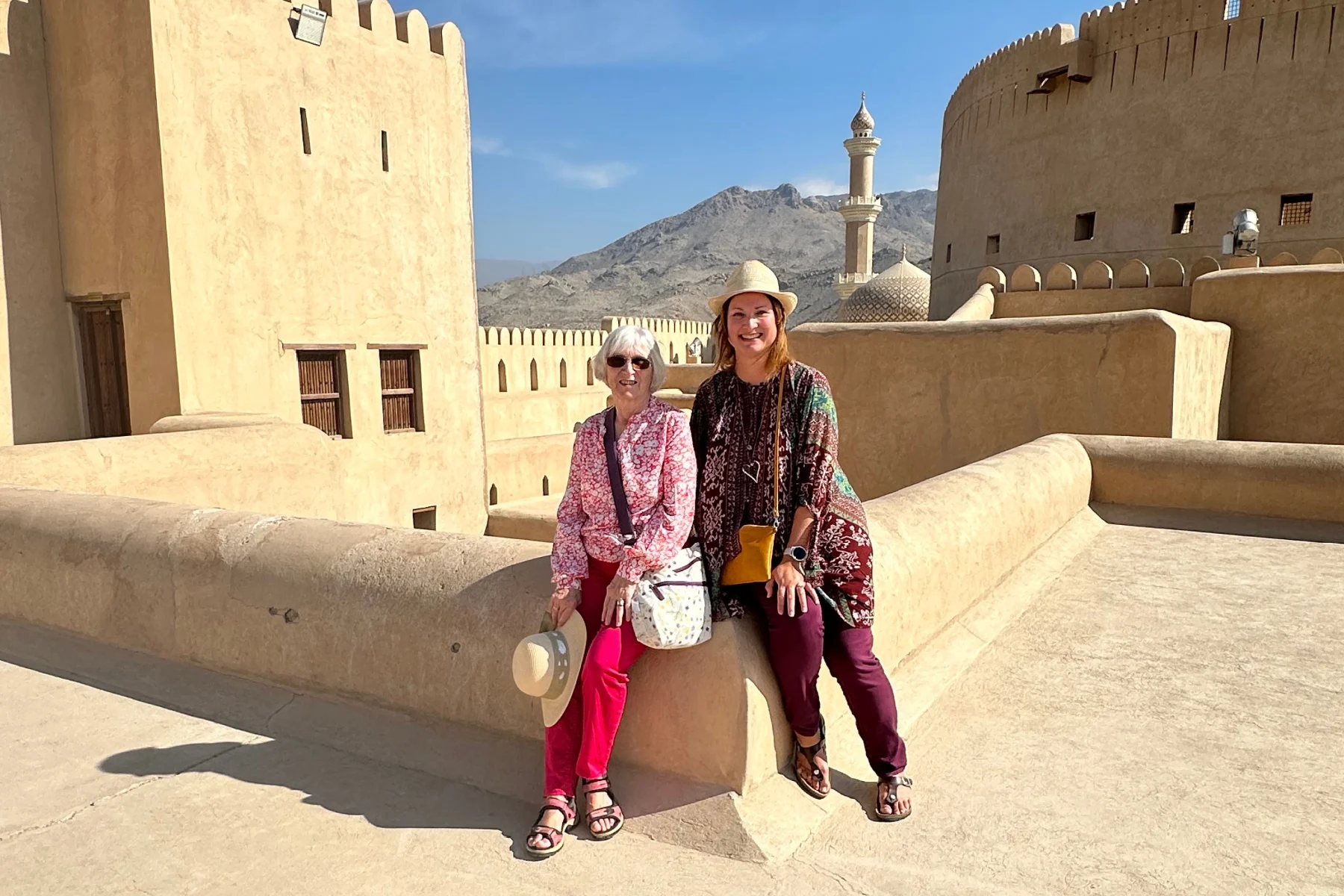 What I wore to Nizwa - my mum and I on the roof of Nizwa fort wearing long sleeve tops and trousers