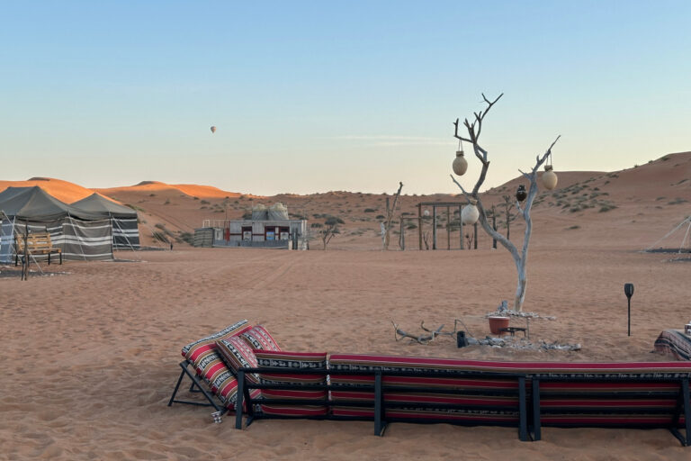 Traditional Bedouin seating and tents at Bader's camp in Wahiba Sands