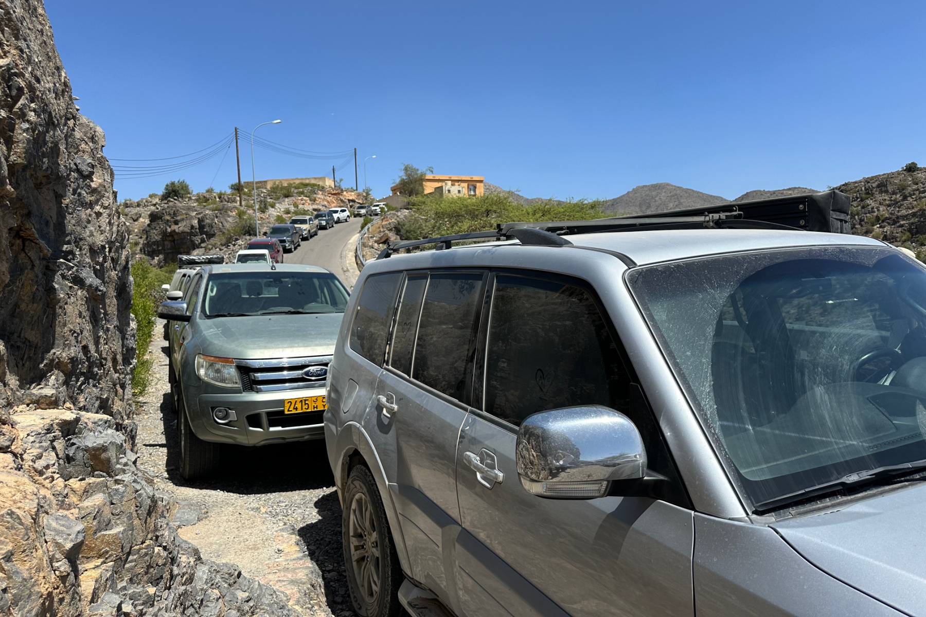 Cars lining the road at the top of the valley about Bani Habib village on Jebel Akhdar