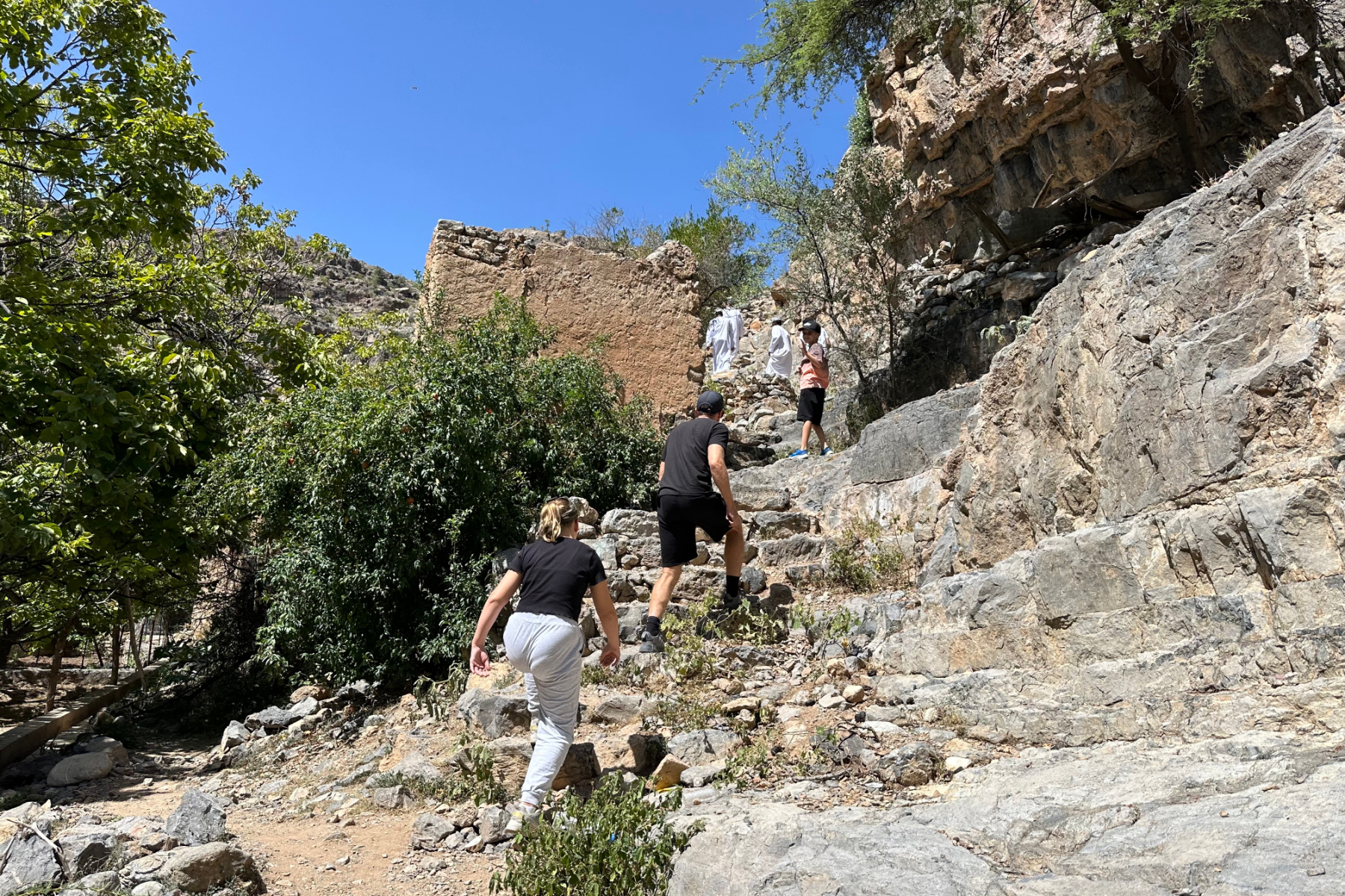 Our daughter and friends climb the ruined steps up into one side of the village in Wadi Bani Habib
