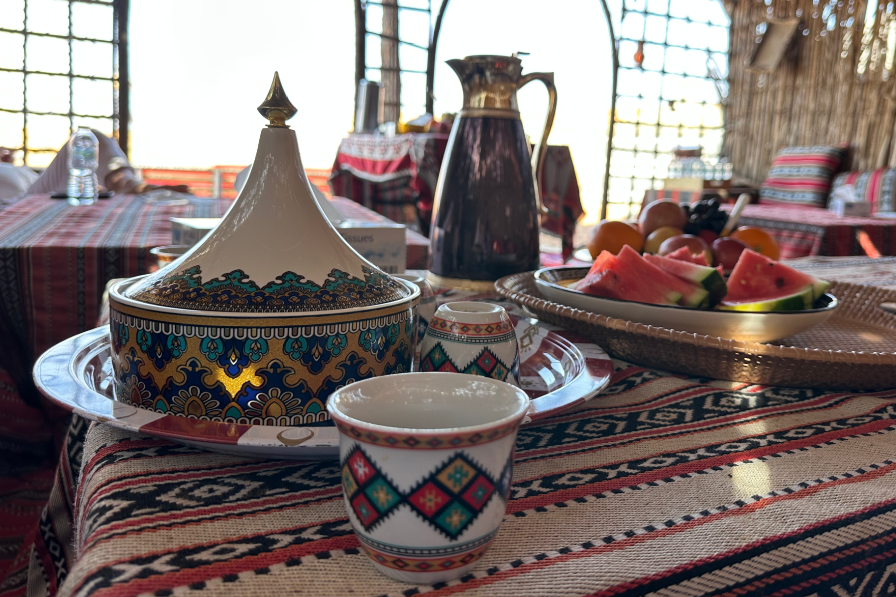 A traditional Omani coffee cup and matching date jar