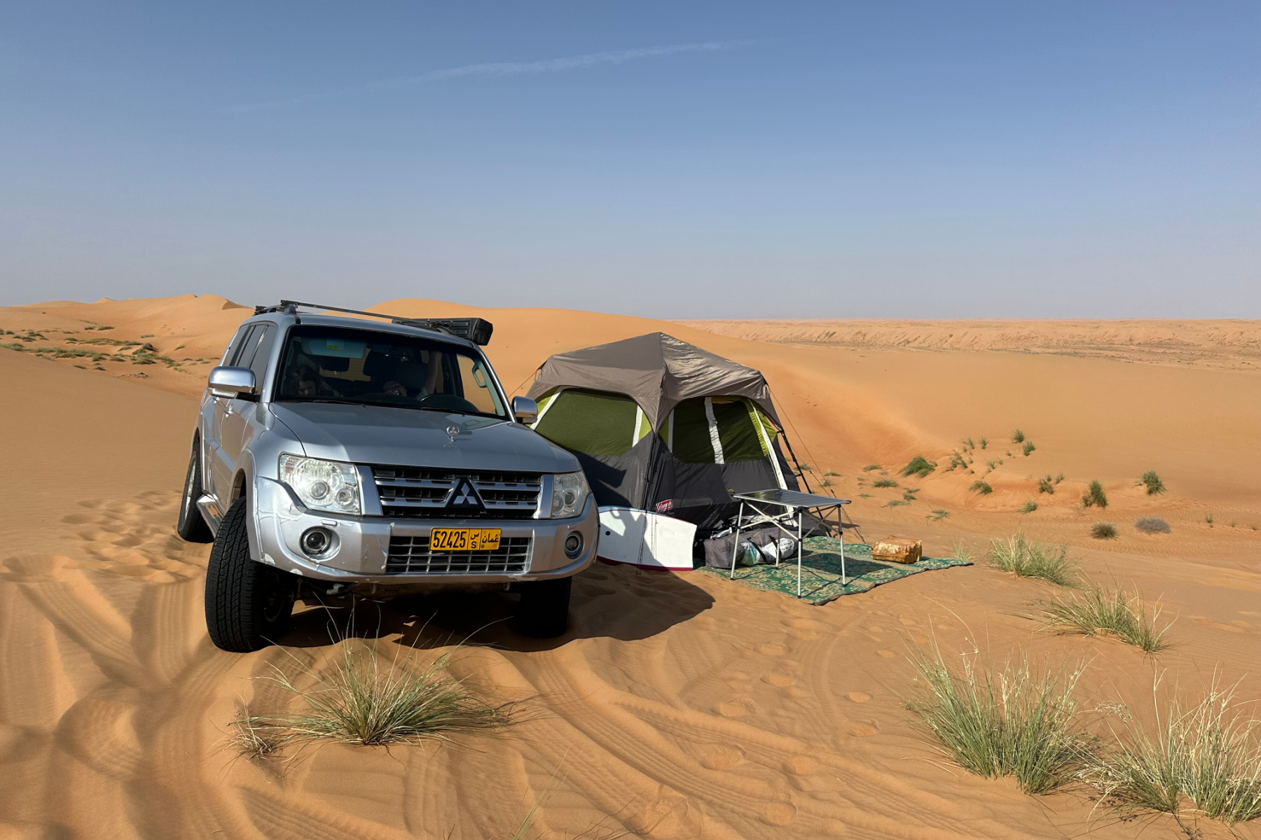 Our Pajero and tent pitched in sand dunes
