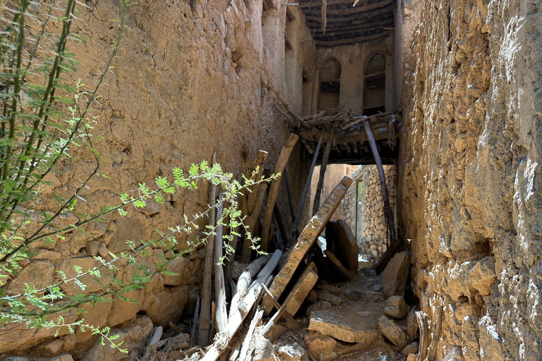 Falling down mud brick and wood beam houses in the village of Bani Habib in the Hajar Mountains