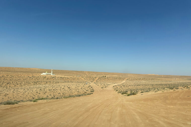 Driving towards the mosque in a remote part of the desert