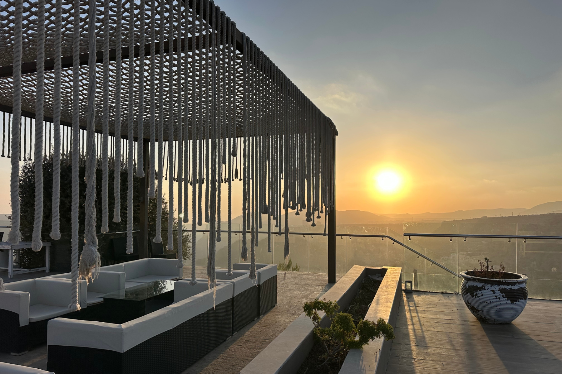 Sunset viewed from seating on the canyon-side terrace at Sahab Resort and Spa on Jebel Akhdar
