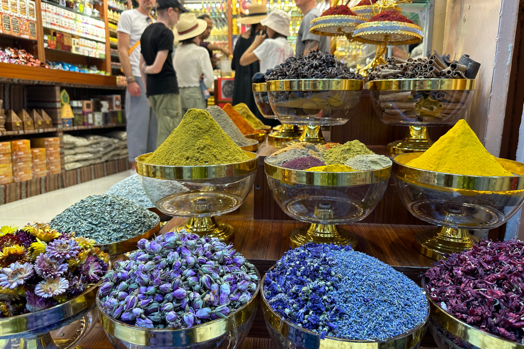 Spices, flowers and scents filed high outside a shop in Muttrah souq