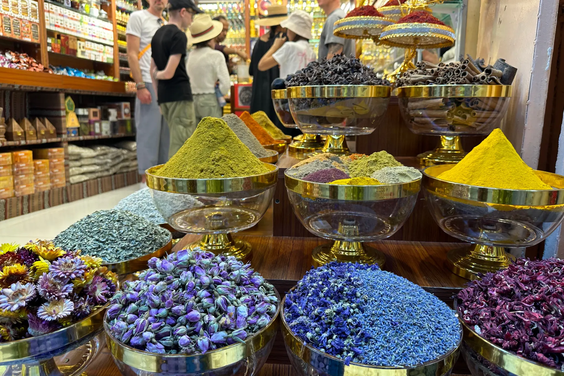 Spices, flowers and scents filed high outside a shop in Muttrah souq