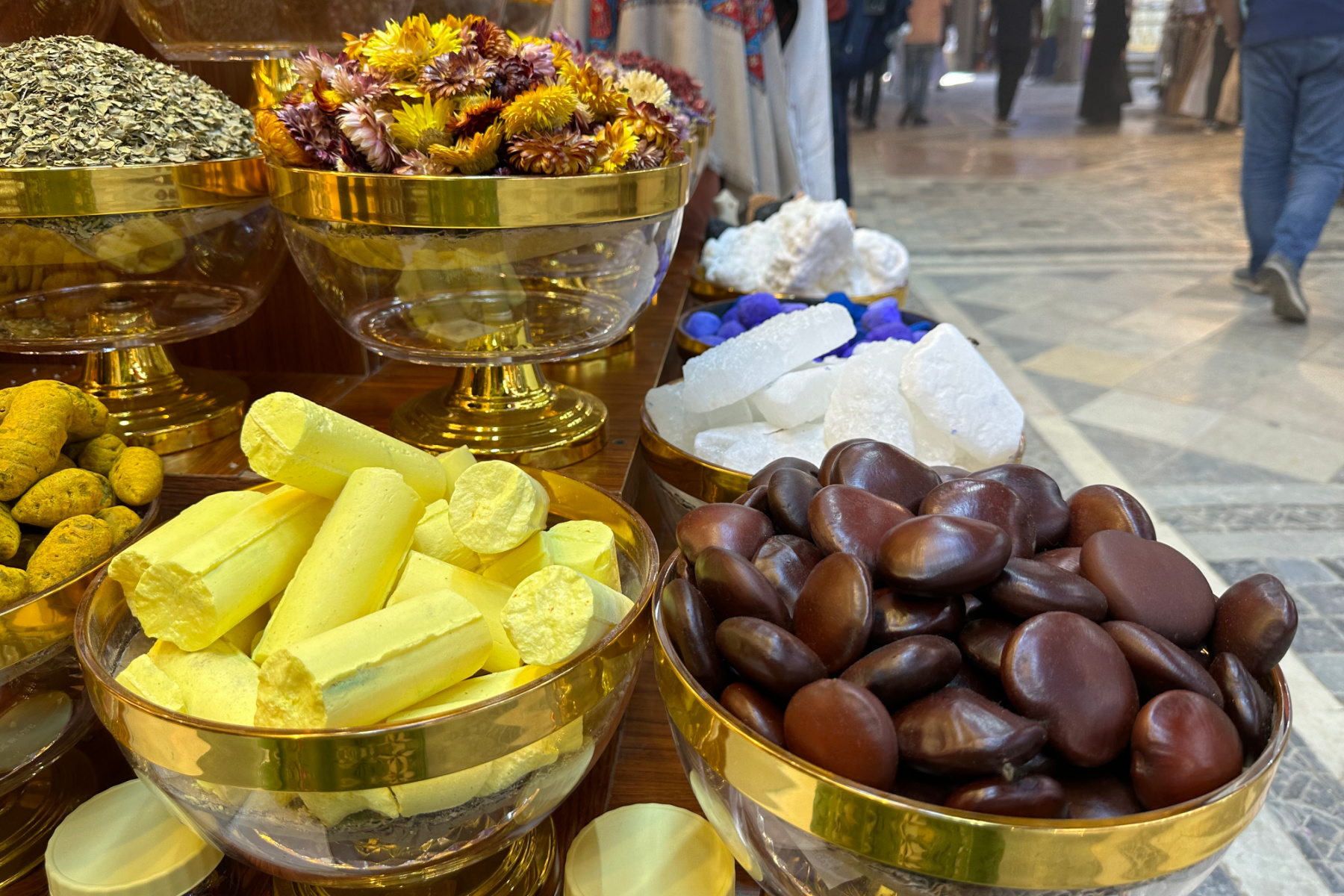 Spices, flowers and scents filed high outside a shop in Muttrah souq
