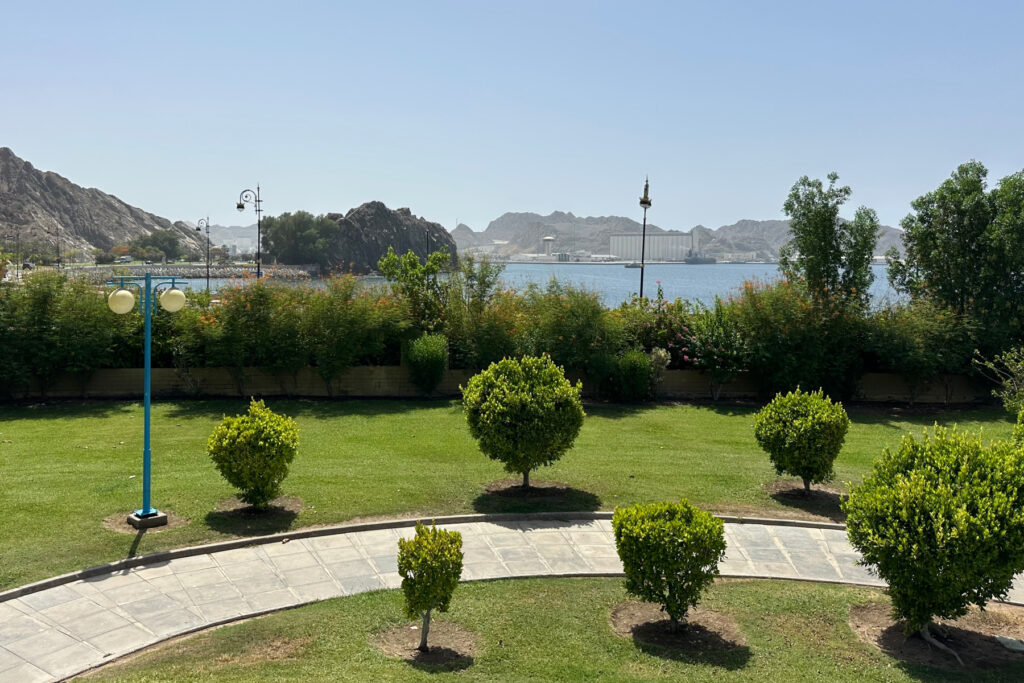 A view of Sultan Qaboos Port from the top of the grassy mound in Riyam Park