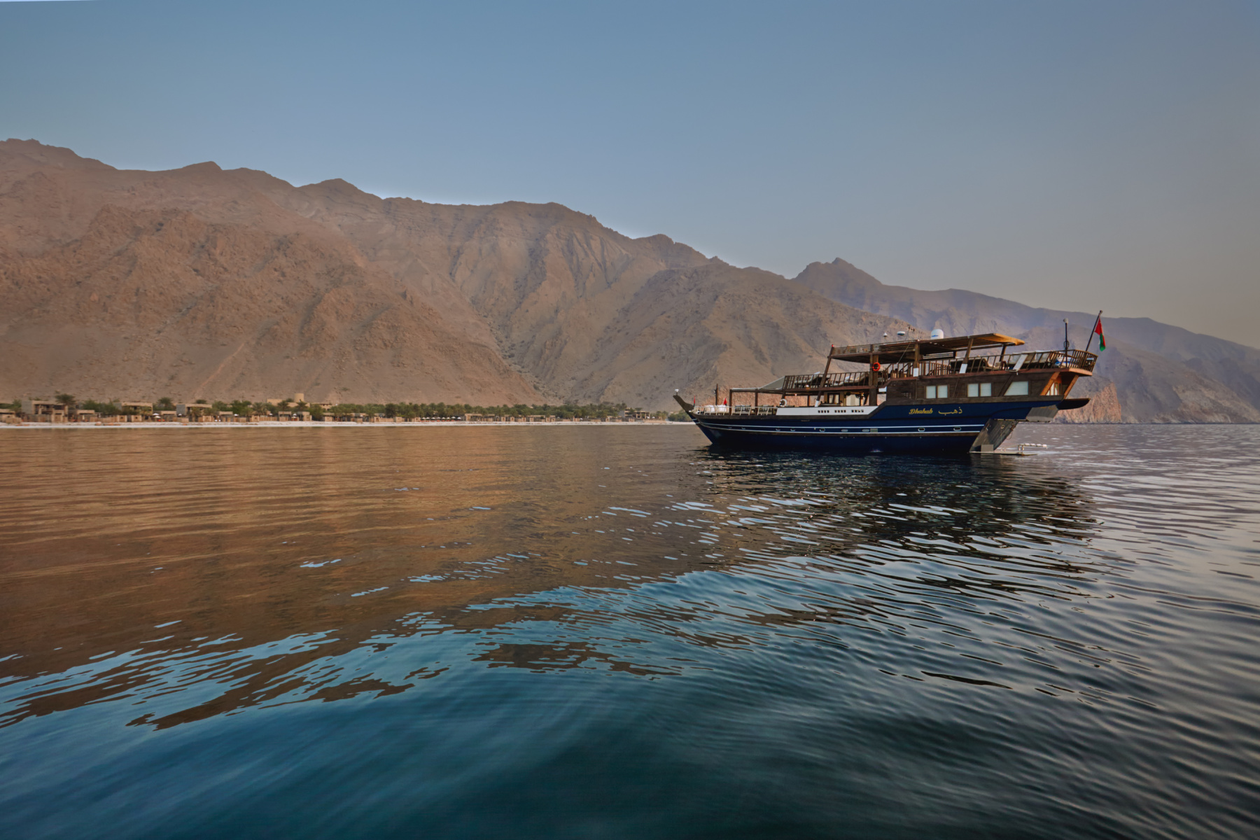 The Dhahab dhow on the water in front of the Six Senses Zighy resort  in Musandam