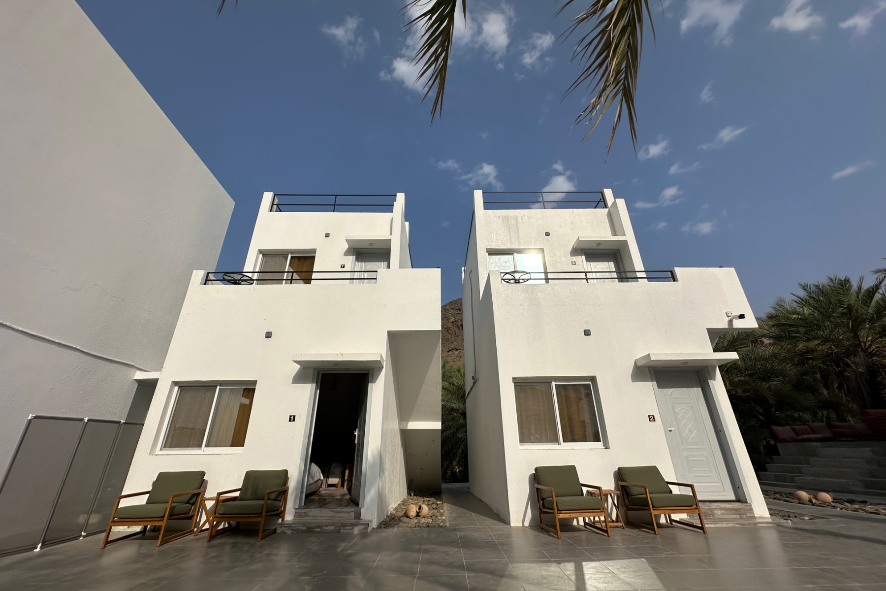 Outside two 2-storey accommodation buildings at the resort