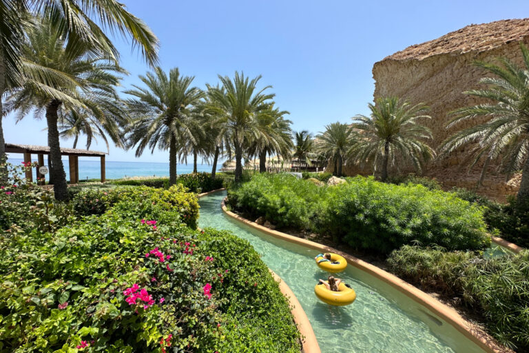 My children in yellow rubber rings floating down the lazy river at the Al Waha hotel