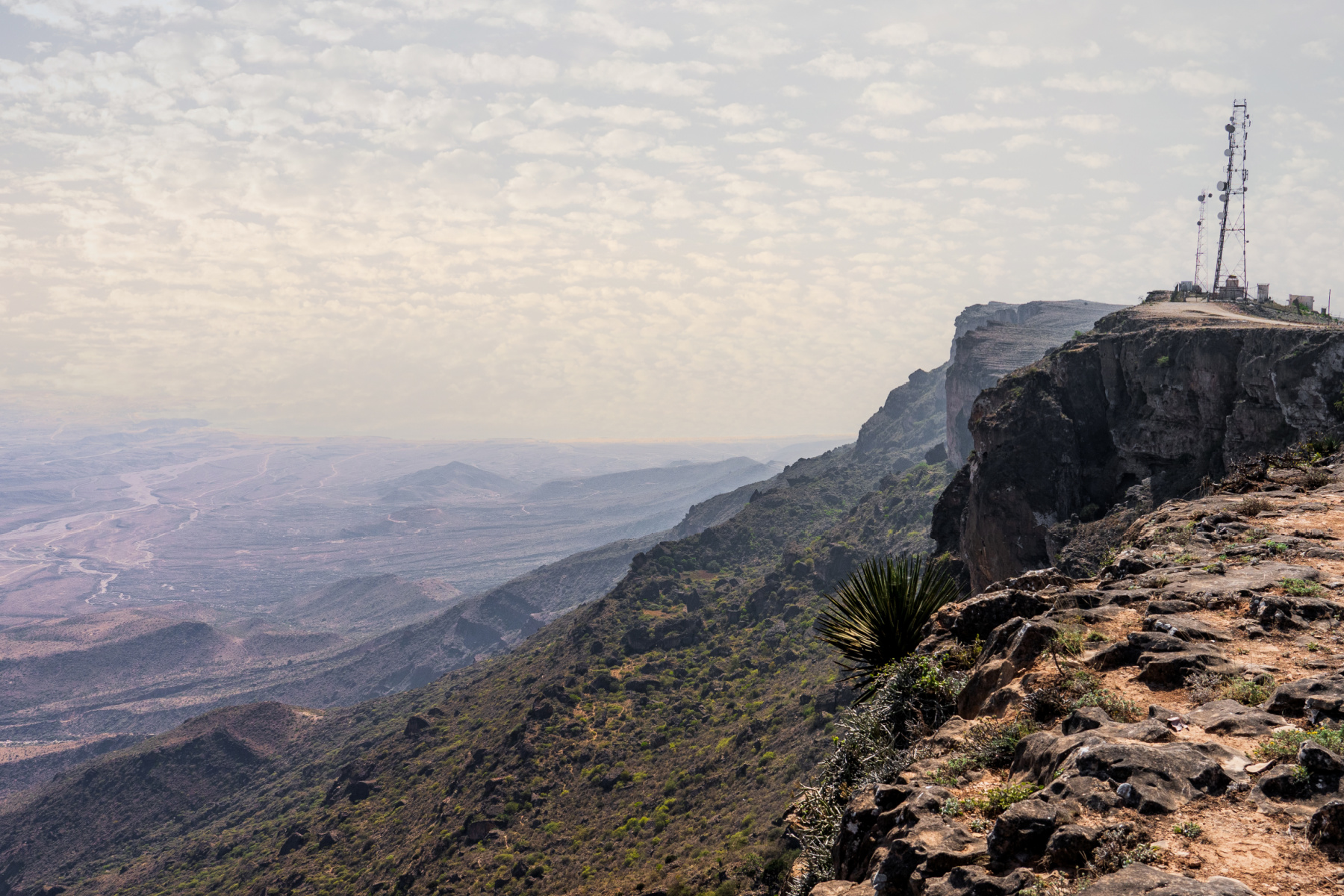 view of Jabal Samhan with majestic mountain range that offers a breathtaking escape into the heart of Oman's wilderness.
