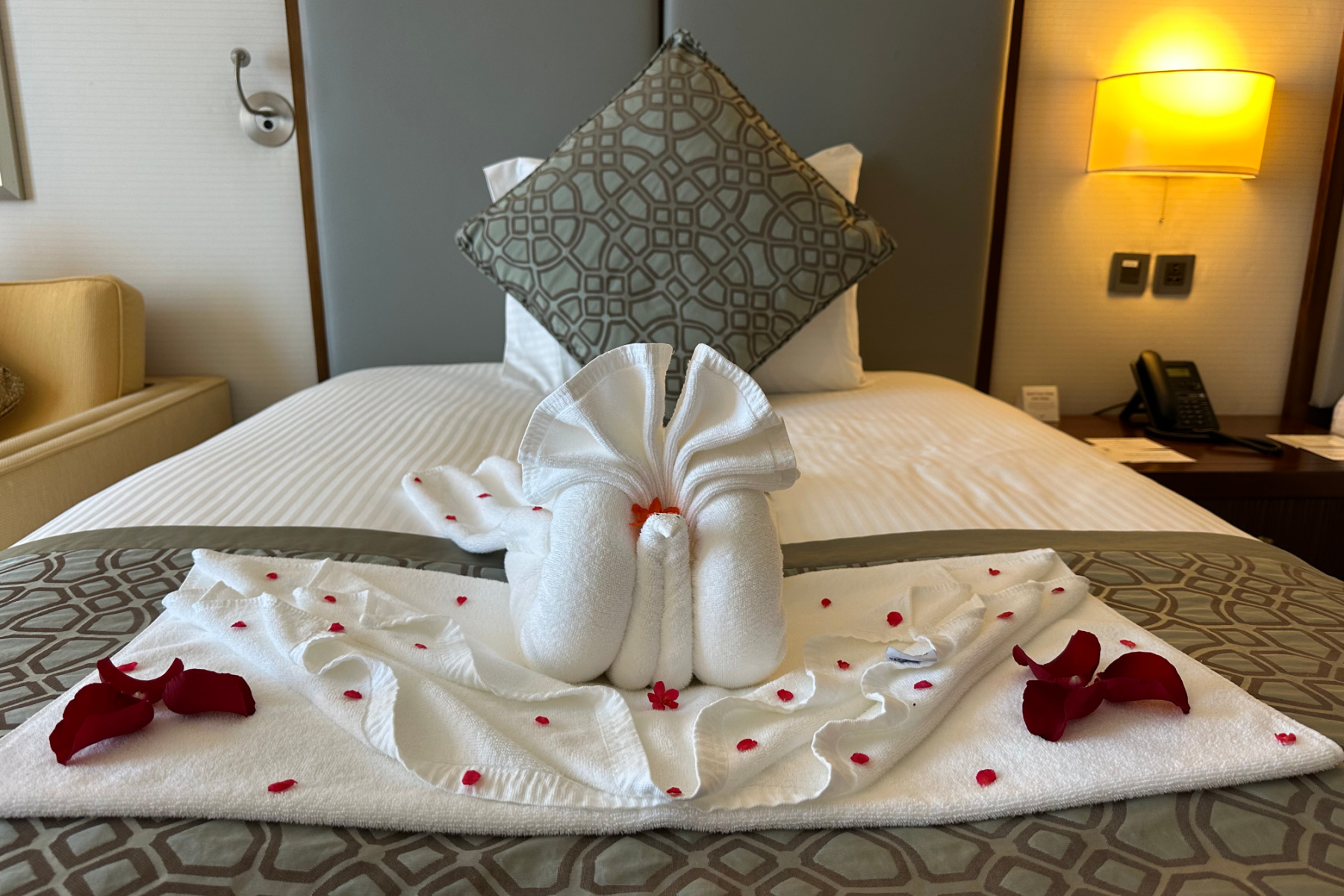 Towel art on one of the large single beds in the twin room of our executive suite