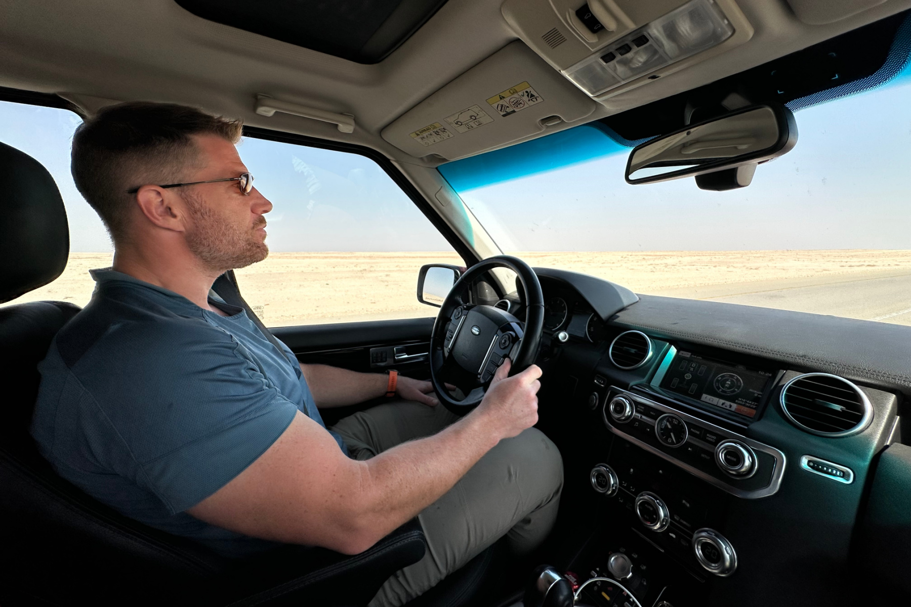 My husband driving out car north on Route 31 between Salalah and Muscat