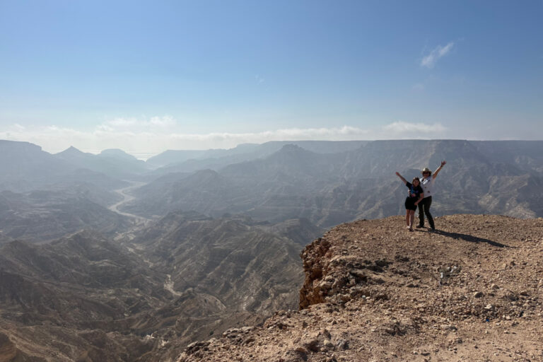 My daughter and stood on the cliff at Jebel Samham east