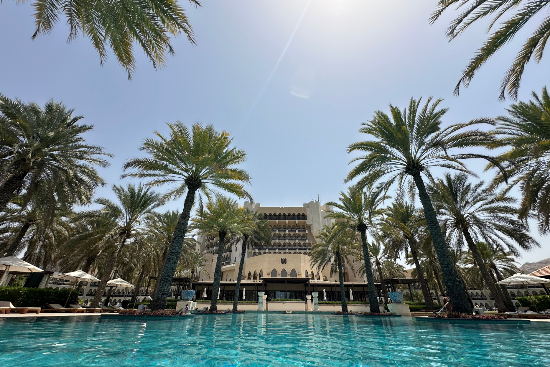 The Al Bustan Palace Ritz Charlton hotel in Muscat viewed from the infinity pool