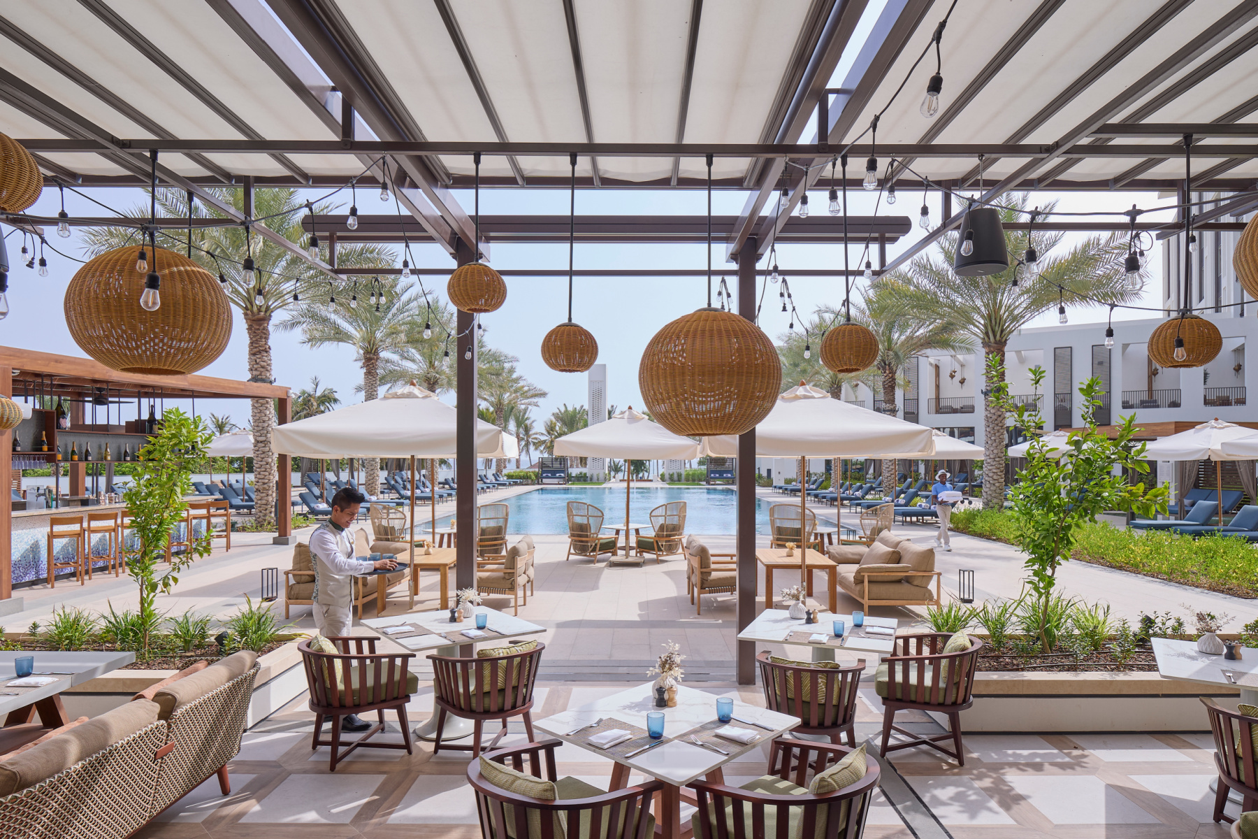 A view of the terrace and pool at the Mandarin Oriental hotel in Muscat