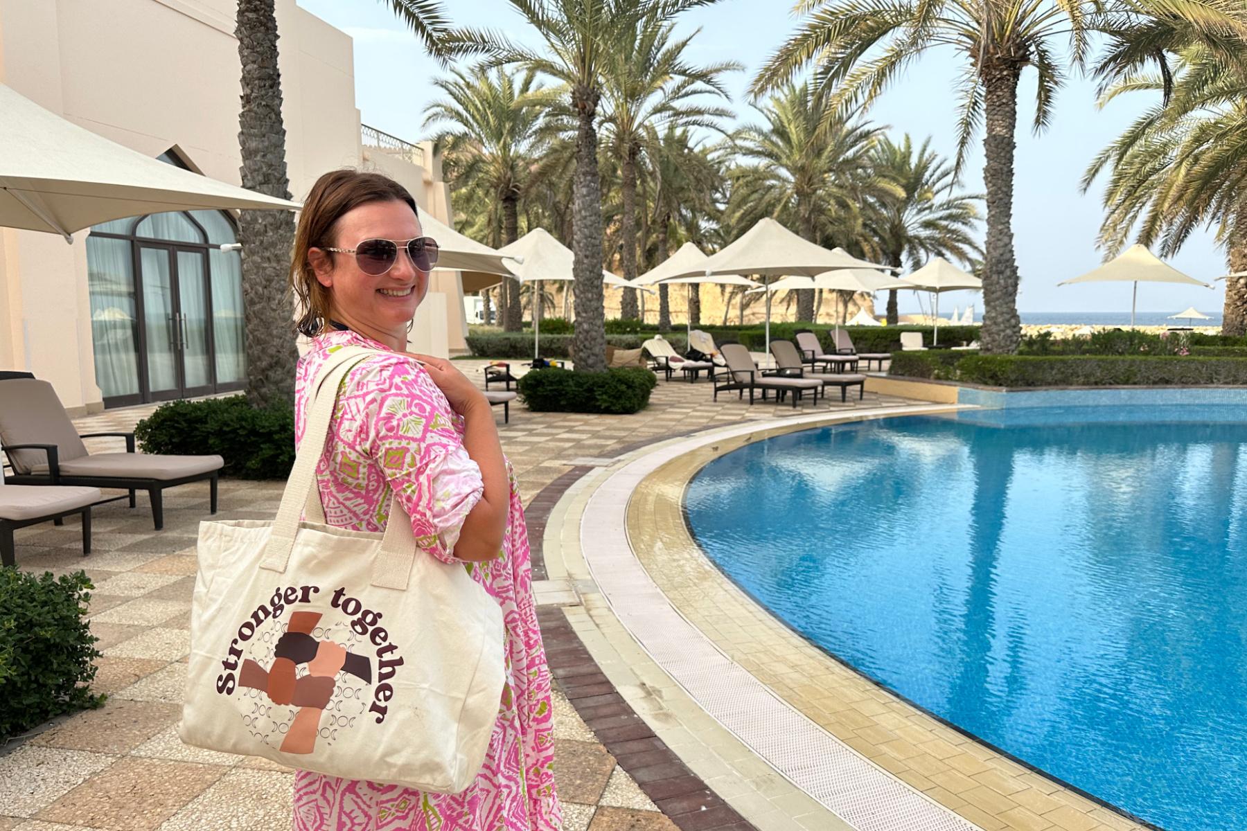 Me stood beside the swimming pool at Hilton Al Bandar Hotel in Muscat