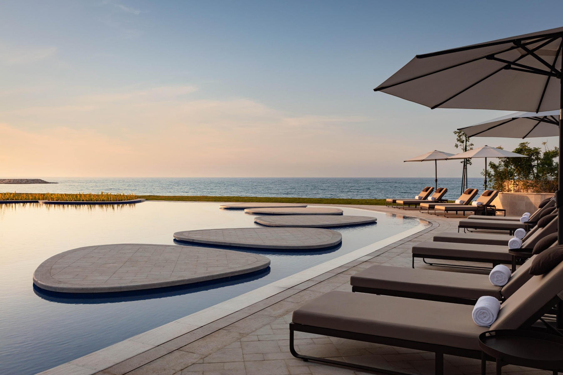 The pool area overlooking the Gulf of Oman at the St. Regis Al Mouj Muscat Resort
