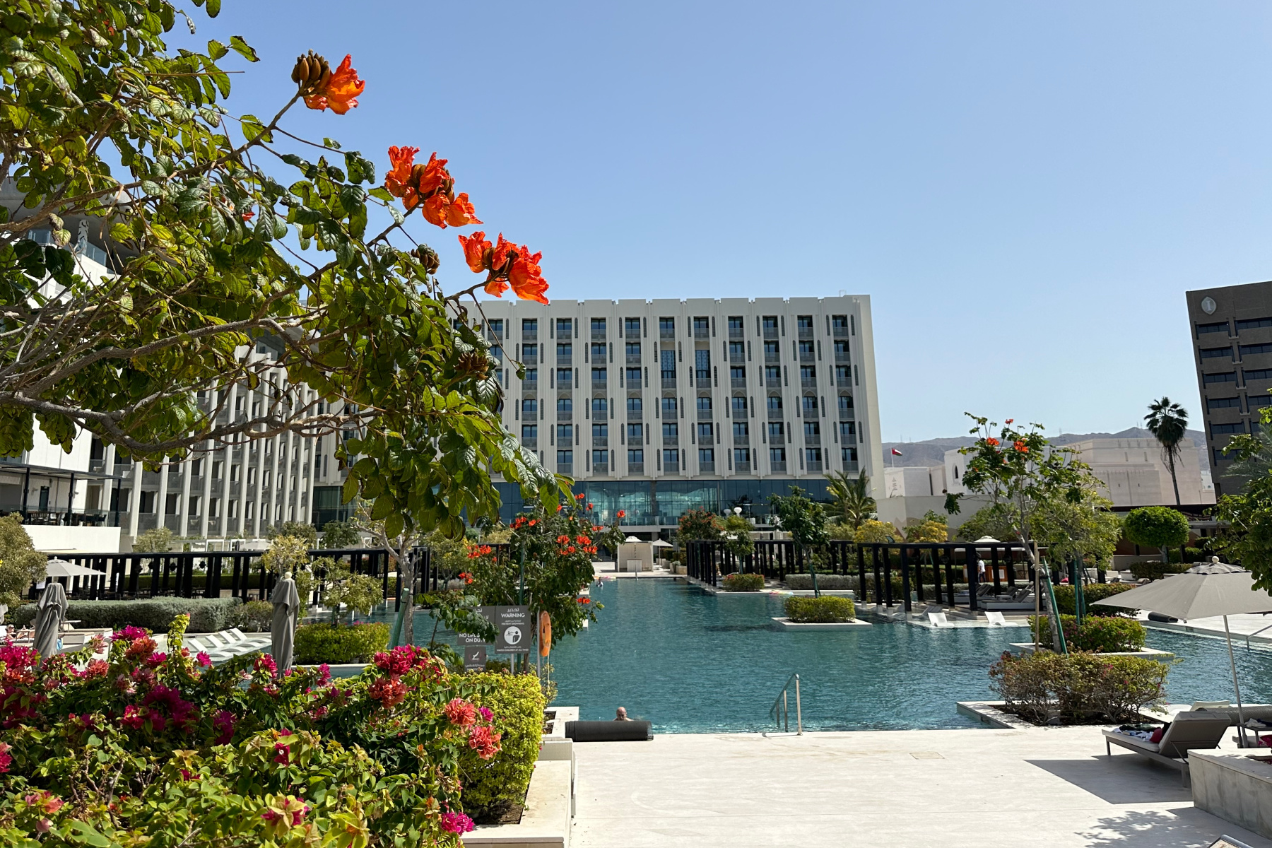 Flowers in front of seating at the outdoor pool area at the W Hotel in Muscat